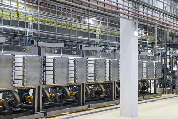 Steel piping system with reverse osmosis membrane housings and pumps inside a desalination plant
