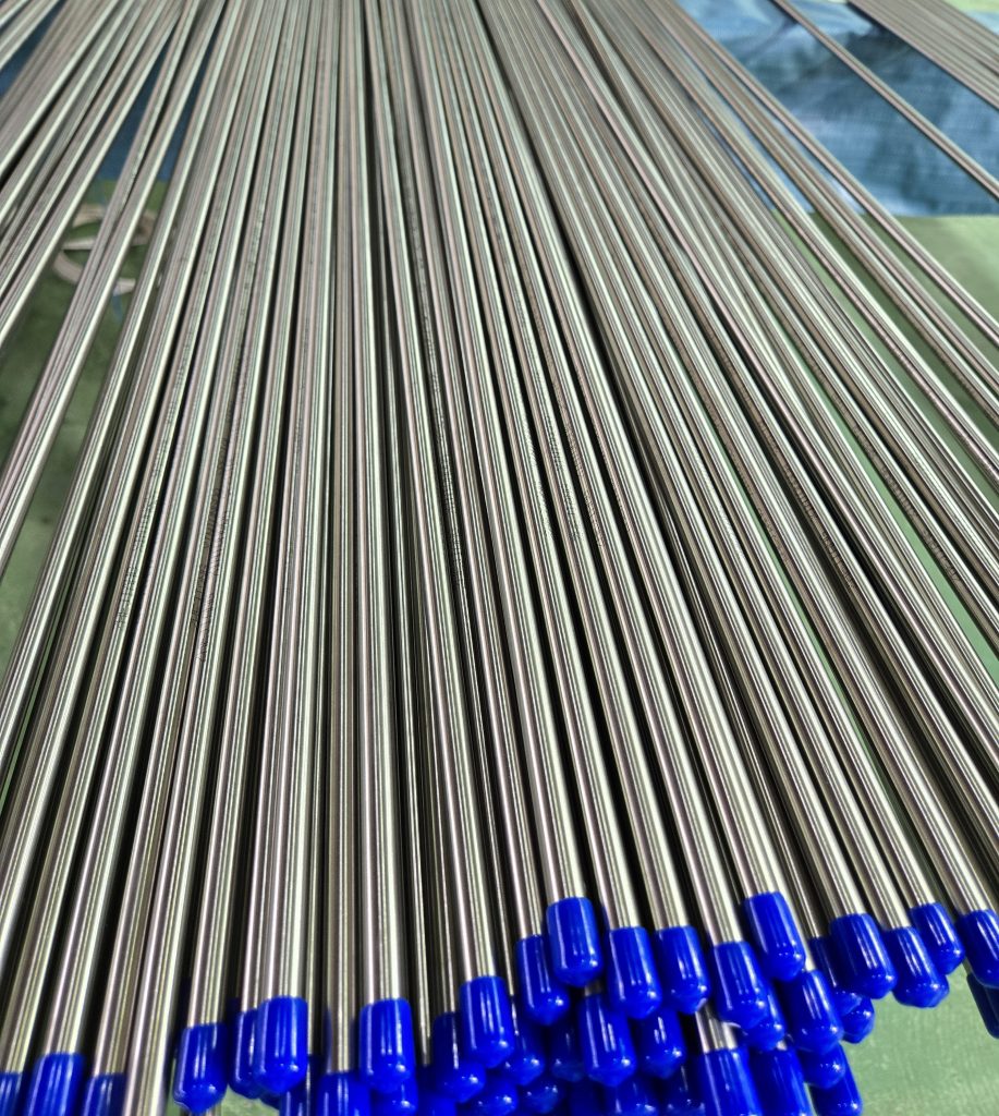 Stock of stainless steel polished pipe with blue tip