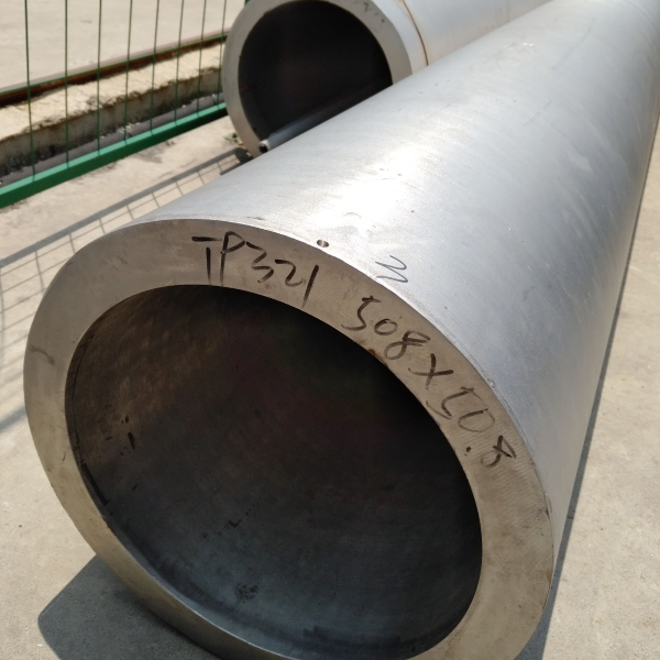 Large SS high pressure pipe lying horizontally on the ground.