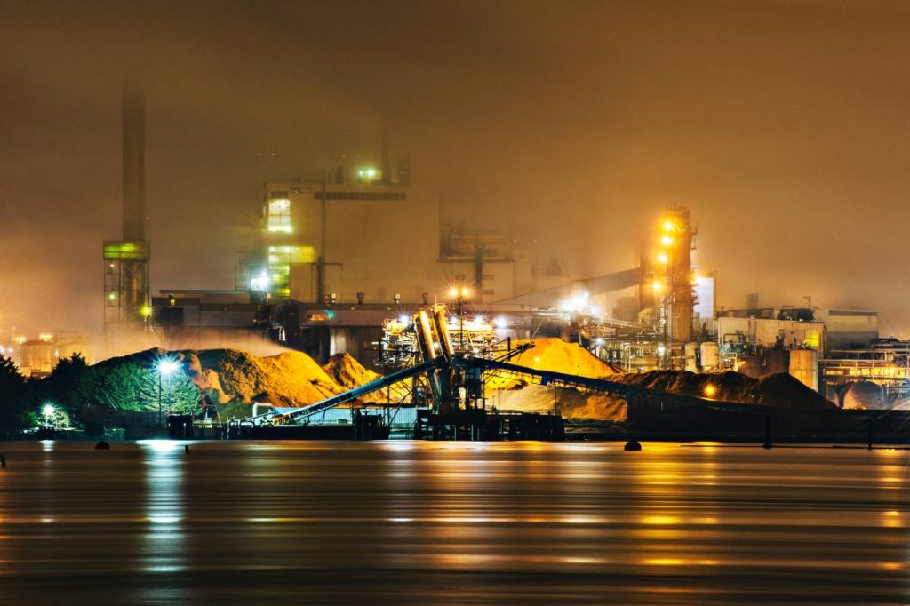 Industrial plant near seawater where corrosion-resistant alloy selection is critical